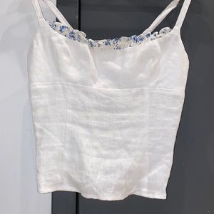 reformation linen top with blue floral trim
